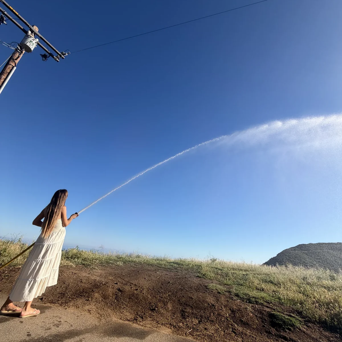 A pregnant homeowner easily operating a Hainy Hydrant private fire hydrant
